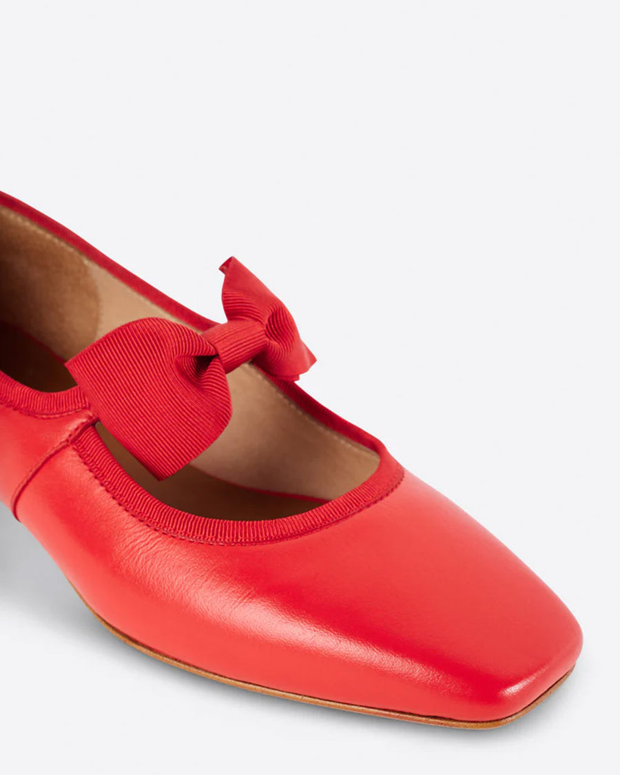 front of cherry red mary jane shoes with bow strap