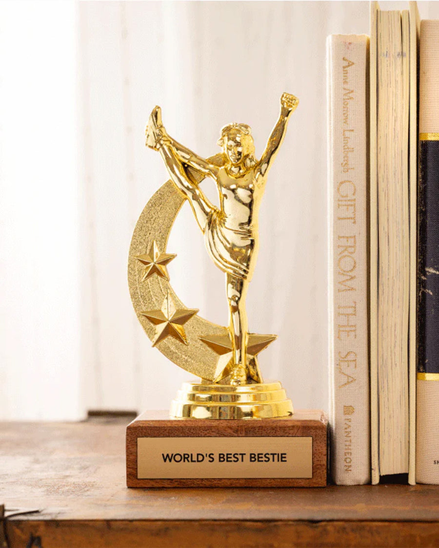 'world's best bestie' gold trophy on a shelf