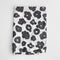 white tea towel with black floral print