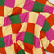 up close of pink, orange, yellow and green diamond tea towel