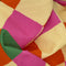 real up close of pink, orange, yellow and green diamond tea towel