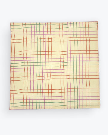 cream tea towel with colorful thin plaid print