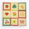 cream tea towel with strawberry, shamrock, banana, heart, house, pretzel, cherry, flower and bow icons