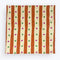 pale yellow and orange striped tea towel with green and pink dots