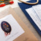 Included: 5 in. x 8 in. Beechwood embroidery hoop Printed 1 page counted cross stitch pattern 14 count Aida cloth 2 tapestry needles DMC floss Organic batting for framing Felt for backing Hand drawn directions