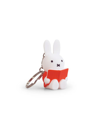 miffy sitting and reading a red book keychain