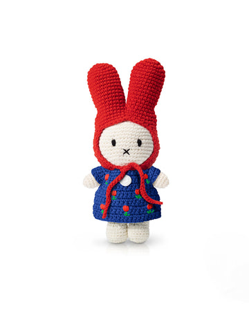 crochet miffy plush with red hat and blue dress with red tulips