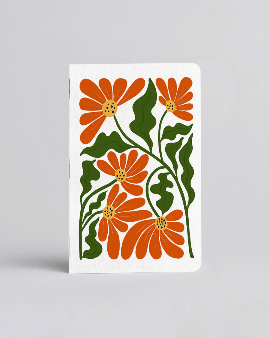 white pocket notebook with orange/red wavy poppy print