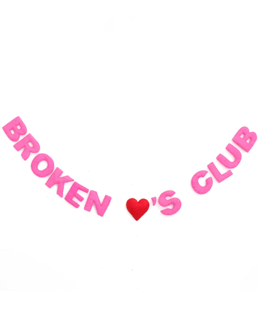 hanging garland with pink stuffed 'broken heart's club', with a red heart in the middle