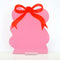 pink squiggle dry erase board with red bow on the top