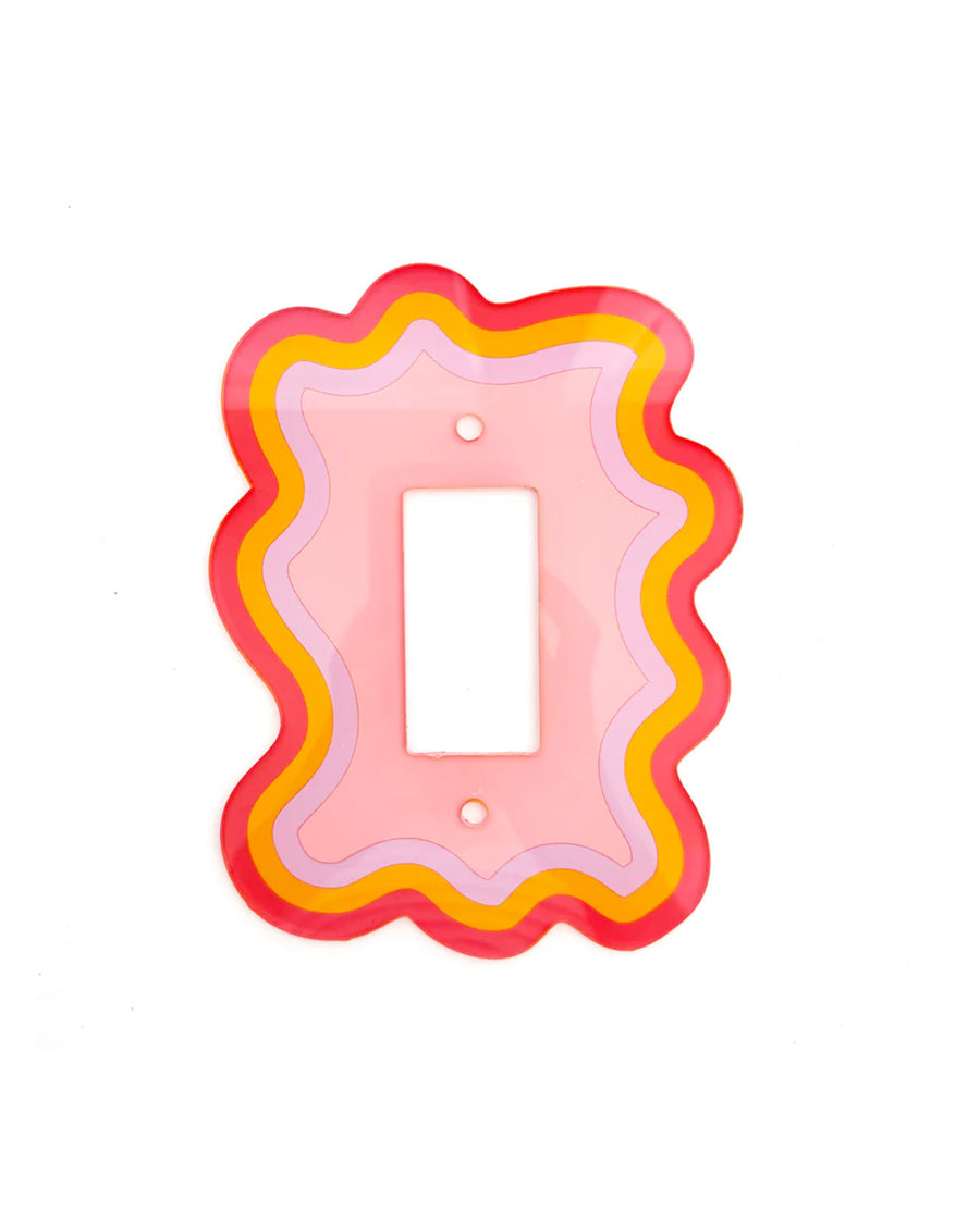 pink rocker light switch plate with red, yellow, and lilac edges