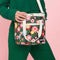 model wearing mini cooler bag with colorful mod inspired floral print