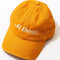 yellow baseball hat with cream embroidered 'al dente' across the front