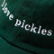 up close of dark green baseball hat with white embroidered 'i love pickles' across the front