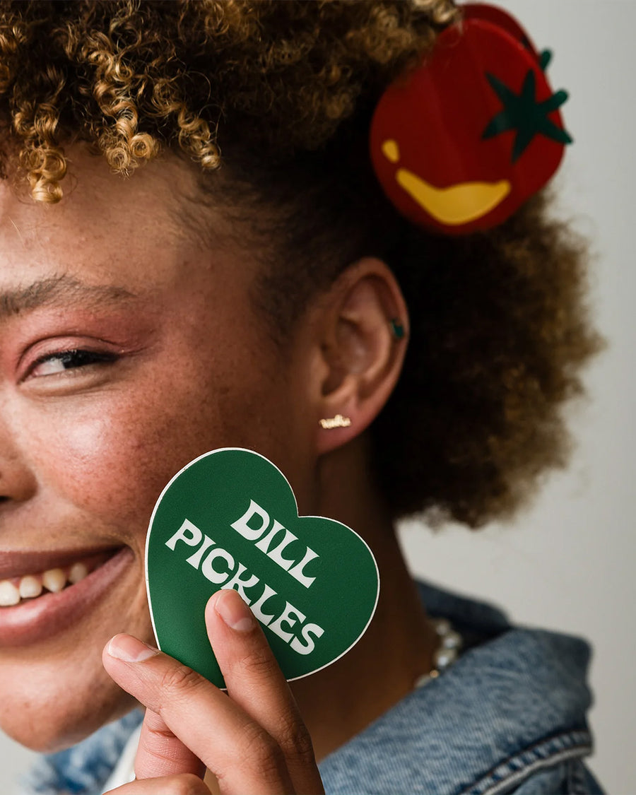 model wearing tomato shaped hair claw