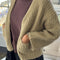 model wearing sand chunky knit open front cardigan with front patch pockets