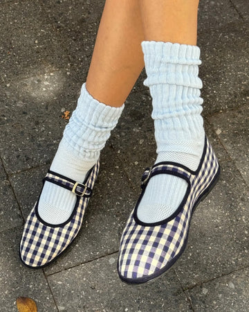 model wearing baby blue slouchy ballet socks with shoes