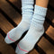 model wearing baby blue slouchy ballet socks