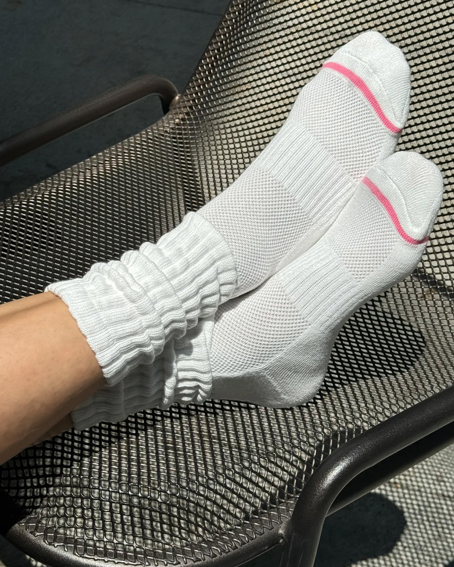 model wearing white slouchy ballet socks with pink trim