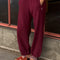 model wearing cabernet colored balloon pants