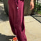 side view of model wearing cabernet colored balloon pants