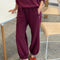 model wearing cabernet colored balloon pants