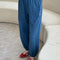 model wearing ocean blue cotton balloon pants with slit side pockets