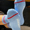 bottoms of model wearing blue socks with two red stripes on the top