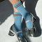 model wearing baby blue socks with brown double stripe on the top