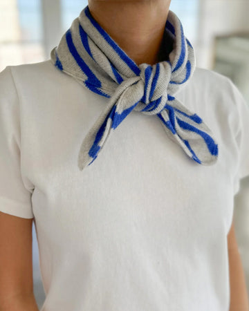 model wearing heather grey and royal blue striped cashmere bandana