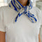 model wearing heather grey and royal blue striped cashmere bandana