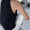 back view of model wearing black knit halter sweater top 