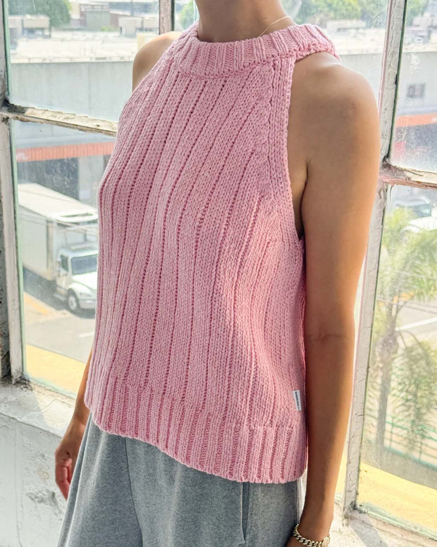 up close of model wearing pink ribbed halter sweater tank