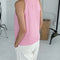 back view of model wearing pink ribbed halter sweater tank