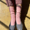 model wearing light pink classic cashmere socks with grey flats on