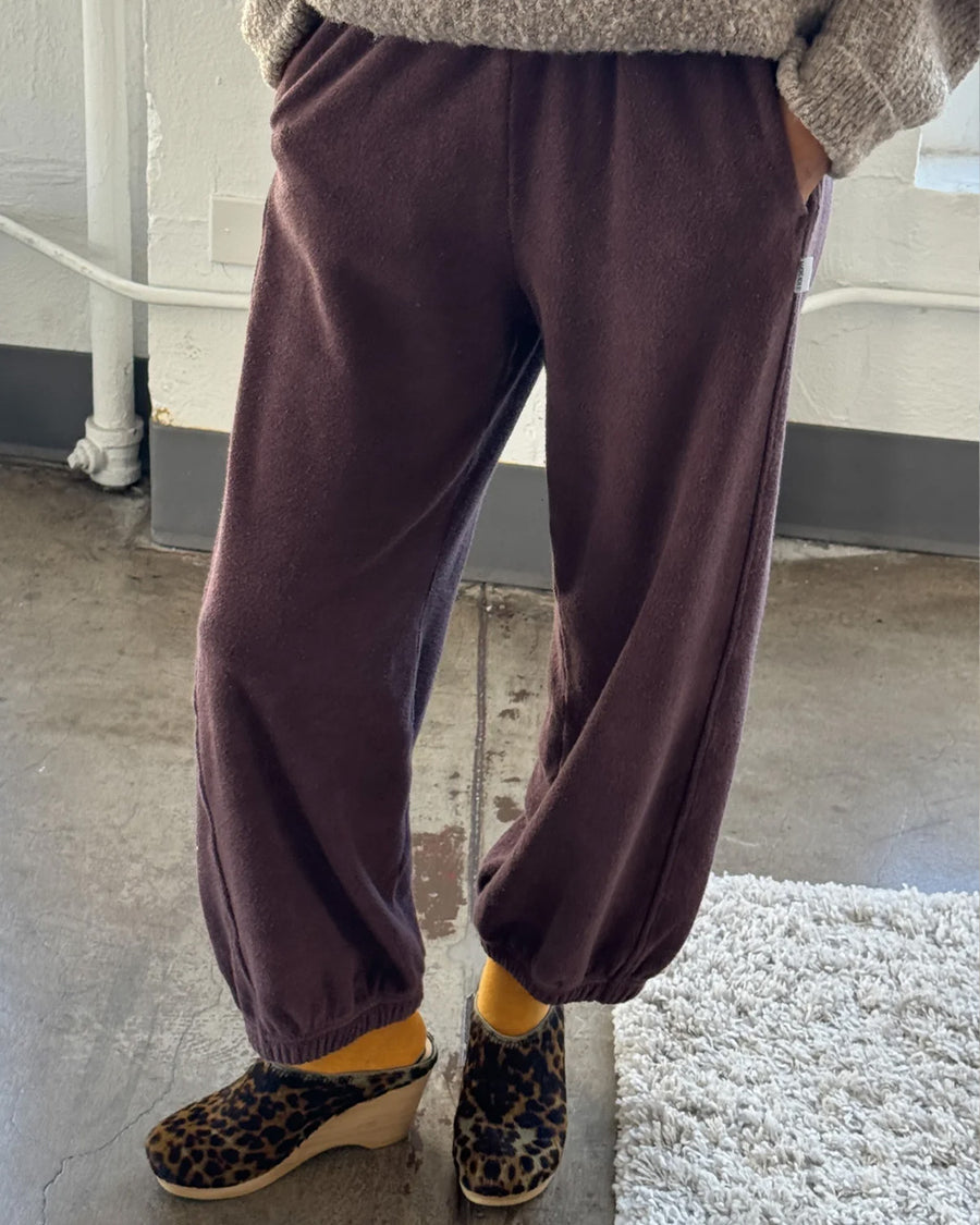 model wearing brown cotton terry balloon pants with pockets