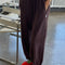 model wearing brown cotton terry balloon pants with pockets