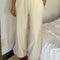 model wearing cream cotton terry balloon pants with pockets