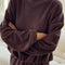 model wearing brown cotton terry long sleeve top with blouson bottom