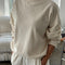 model wearing cream cotton terry long sleeve top with blouson bottom