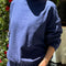 model wearing midnight colored long sleeve mock neck top with elastic hem