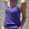 model wearing lavender basic tank cami layered on top of emerald cami