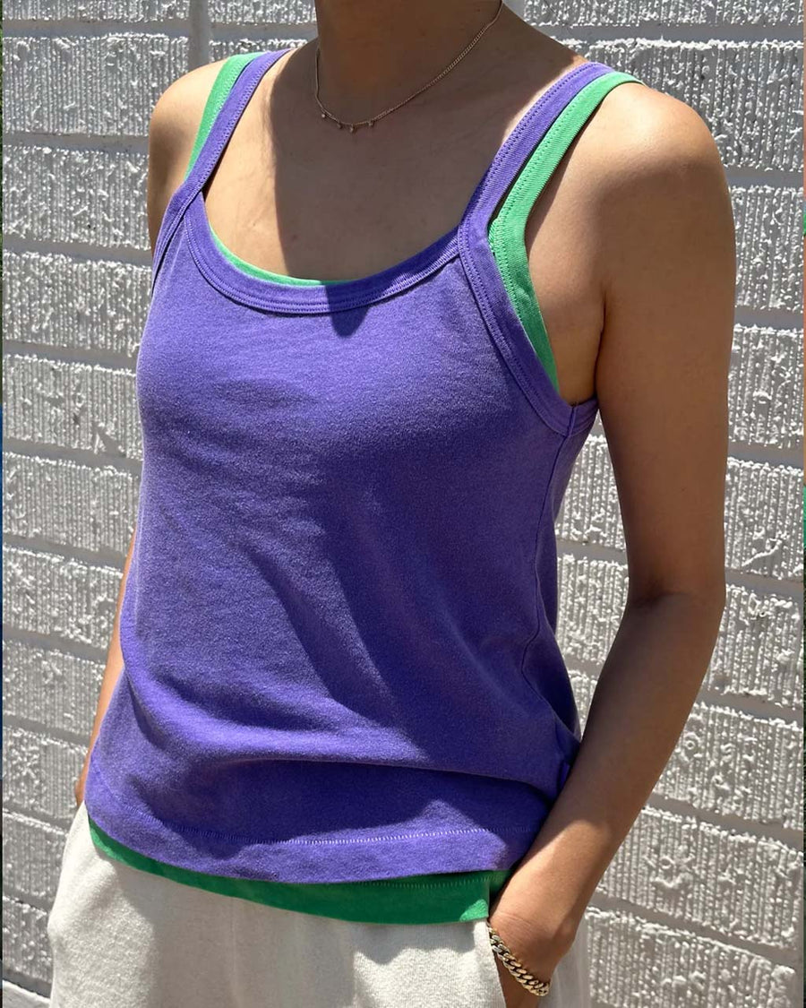 model wearing lavender basic tank cami layered on top of emerald cami