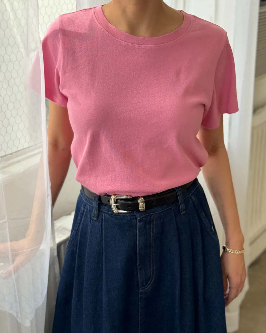 model wearing strawberry sorbet relaxed tee with slight distressing on the neckline and arm holes