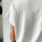 back view of model wearing vintage white relaxed vintage tee