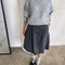 model wearing heather grey fuzzy sweater with relaxed fit and mock neck