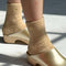 model wearing fuzzy tan socks with gold metallic heart detail