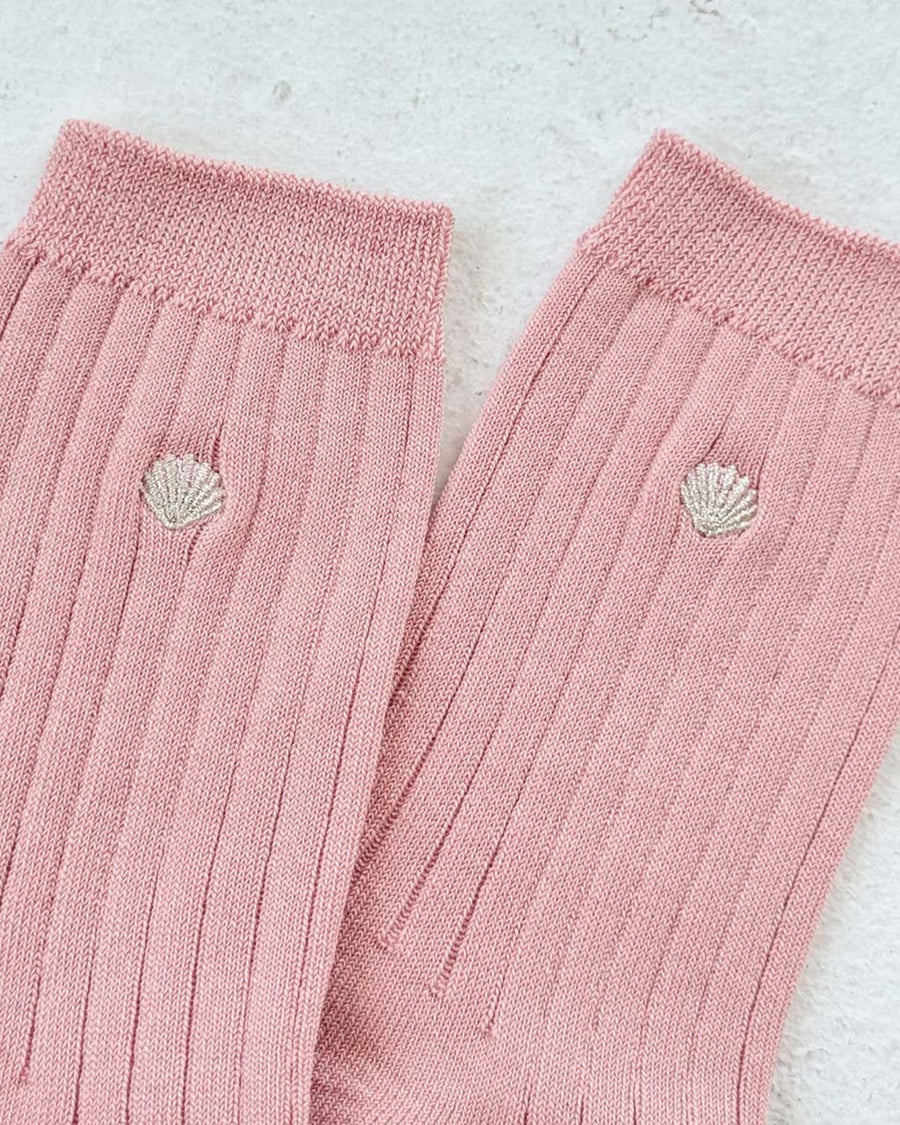 pair of light pink ribbed socks with silver seashell detail