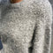 up close of model wearing heather grey fuzzy sweater