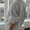 back view of model wearing relaxed fit heather grey french terry quarter zip sweatshirt